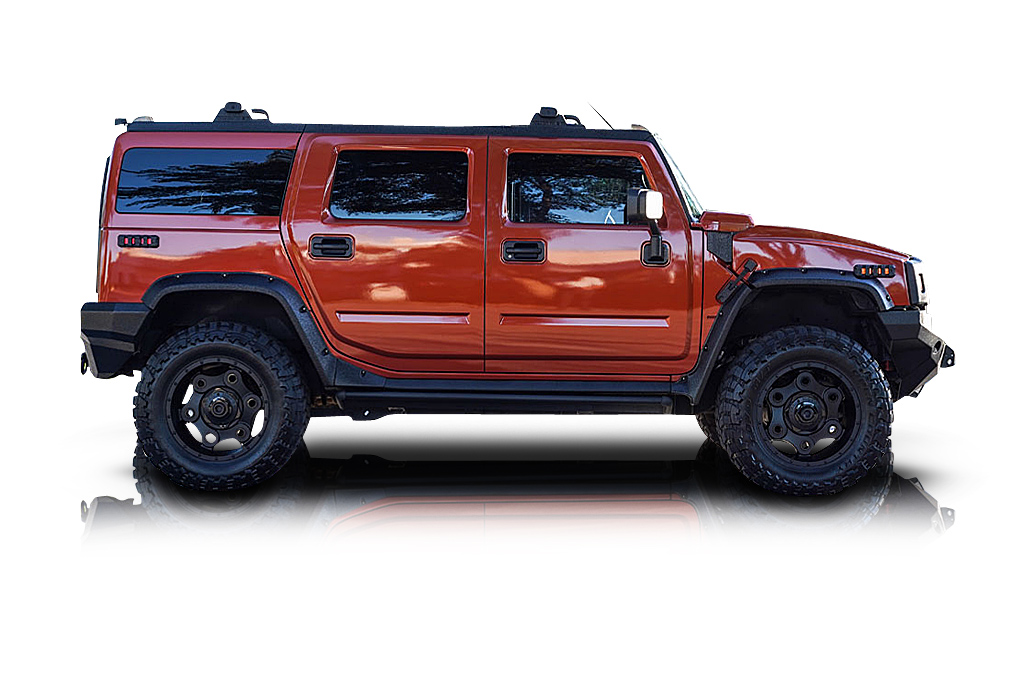 An incredible side shot photo of aHummer H2 that you should buy.