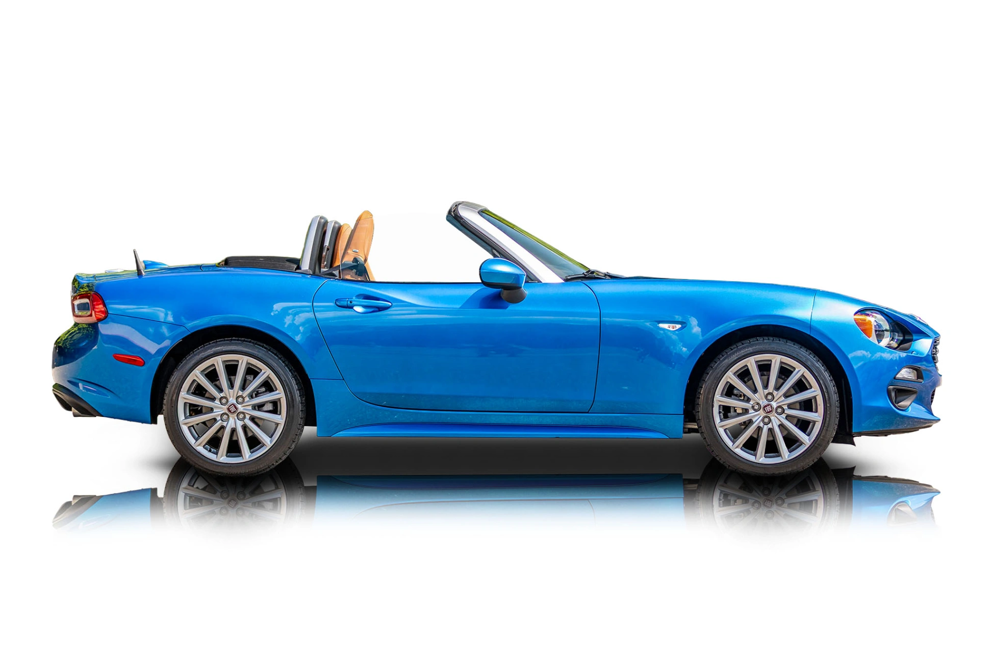 An incredible side shot photo of aFiat 124 Spider that you should buy.