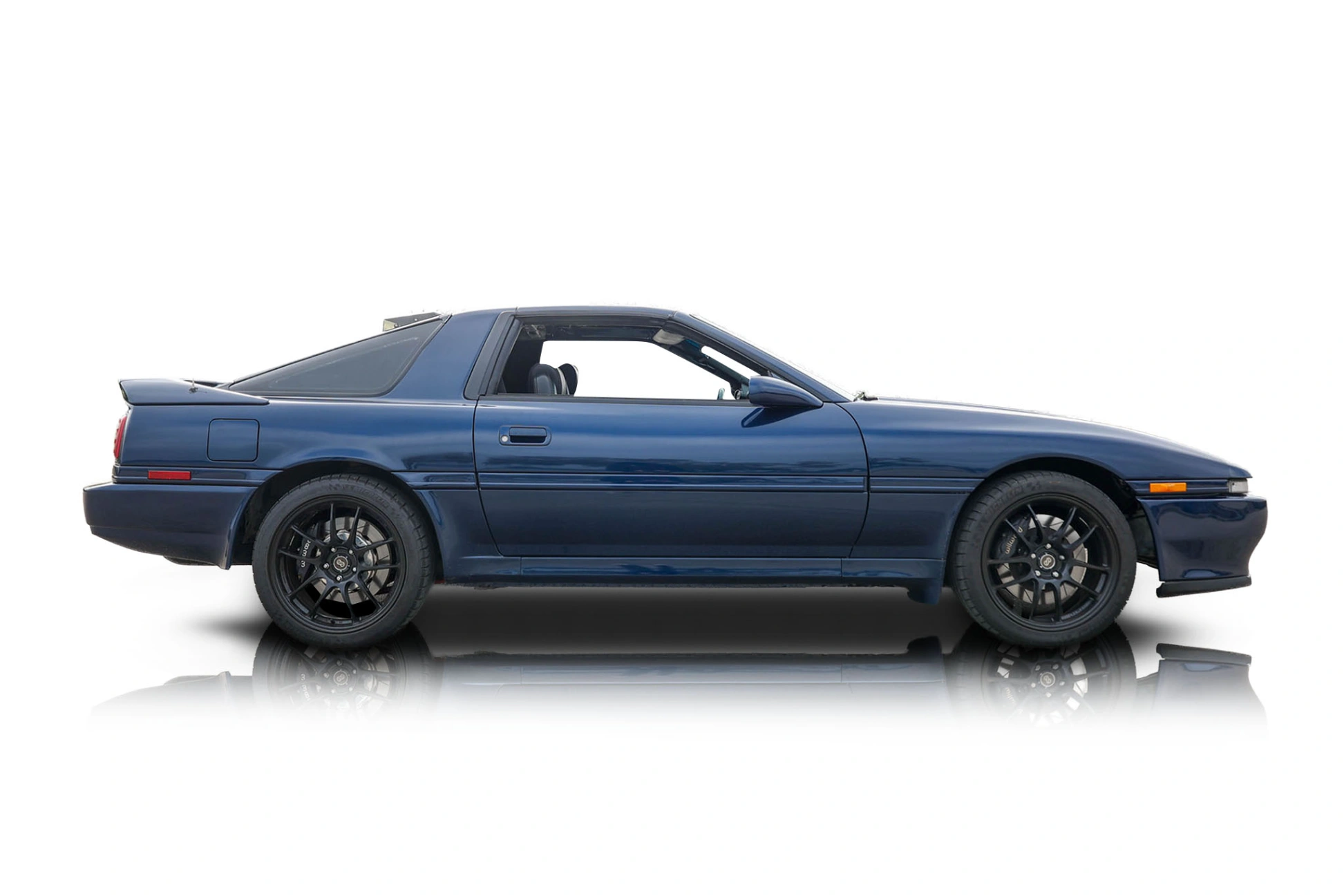 An incredible side shot photo of a Toyota Supra that you should buy.