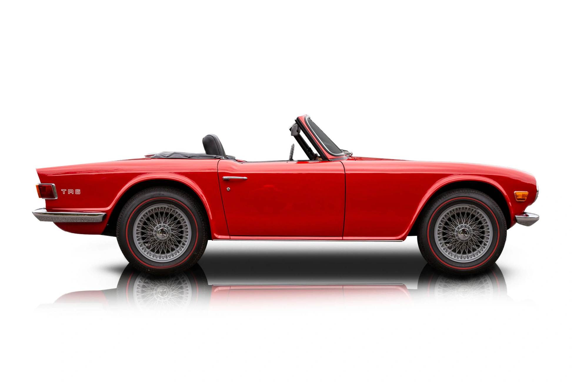 An incredible side shot photo of a Triumph TR6 that you should buy.