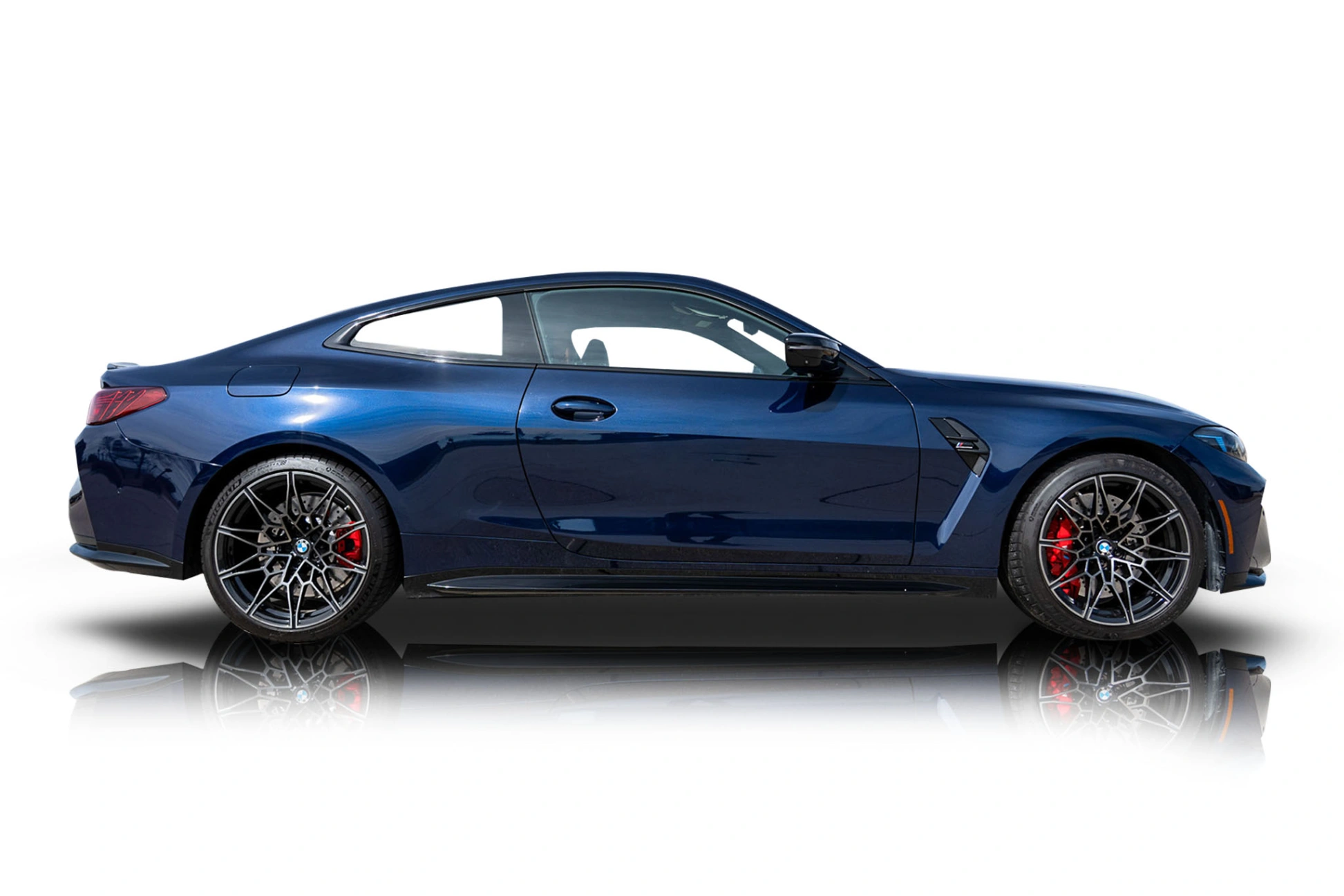 An incredible side shot photo of a BMW M4 that you should buy.