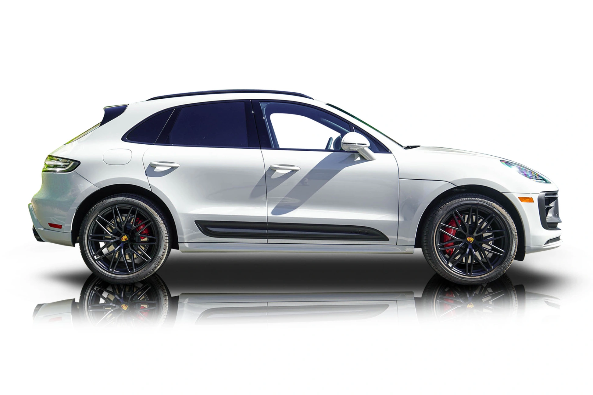 An incredible side shot photo of a Porsche Macan that you should buy.