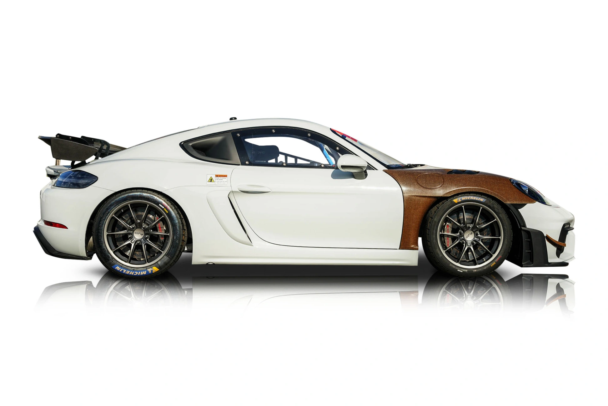 An incredible side shot photo of a Porsche 718 Cayman that you should buy.