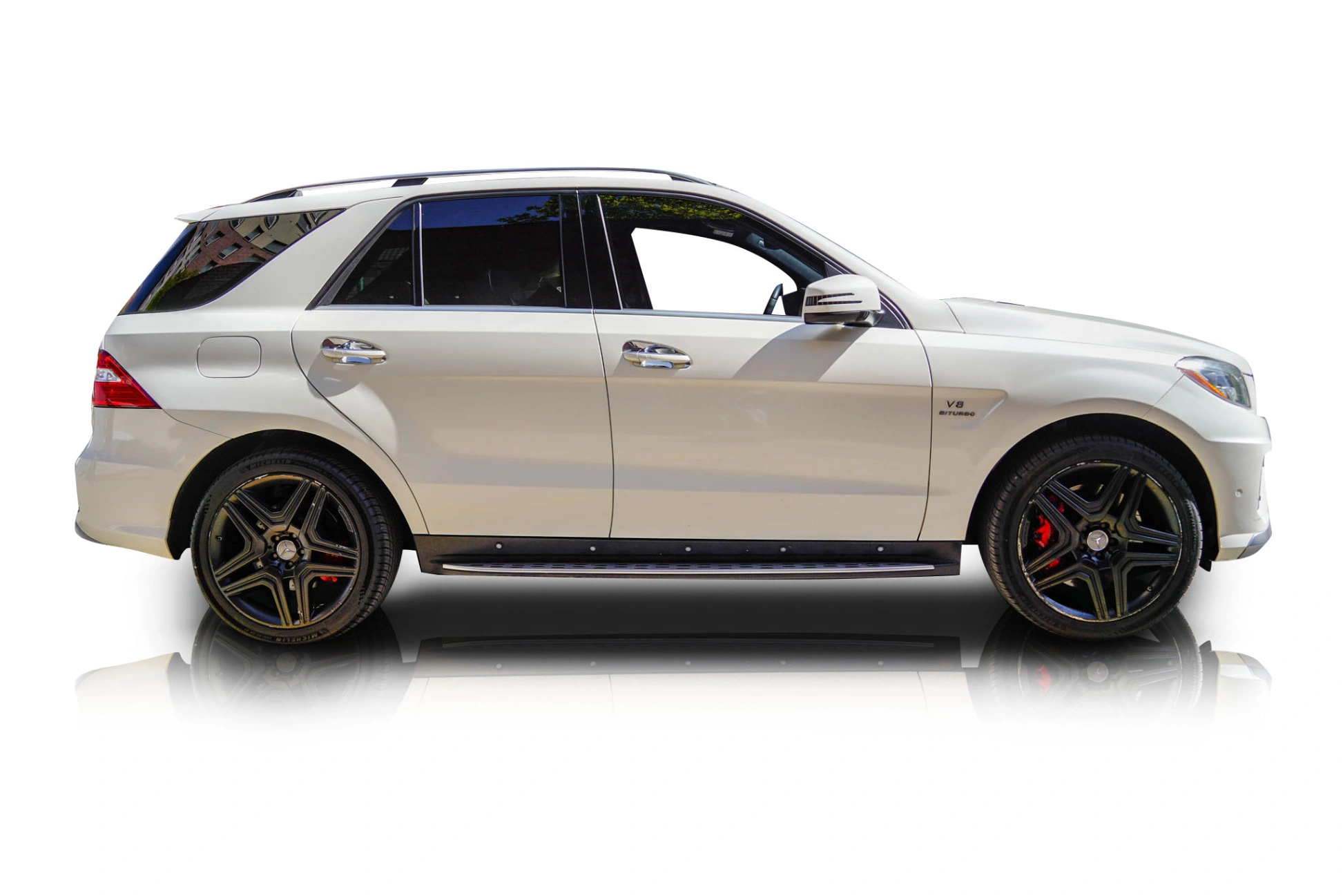 An incredible side shot photo of a Mercedes-Benz ML63 AMG that you should buy.