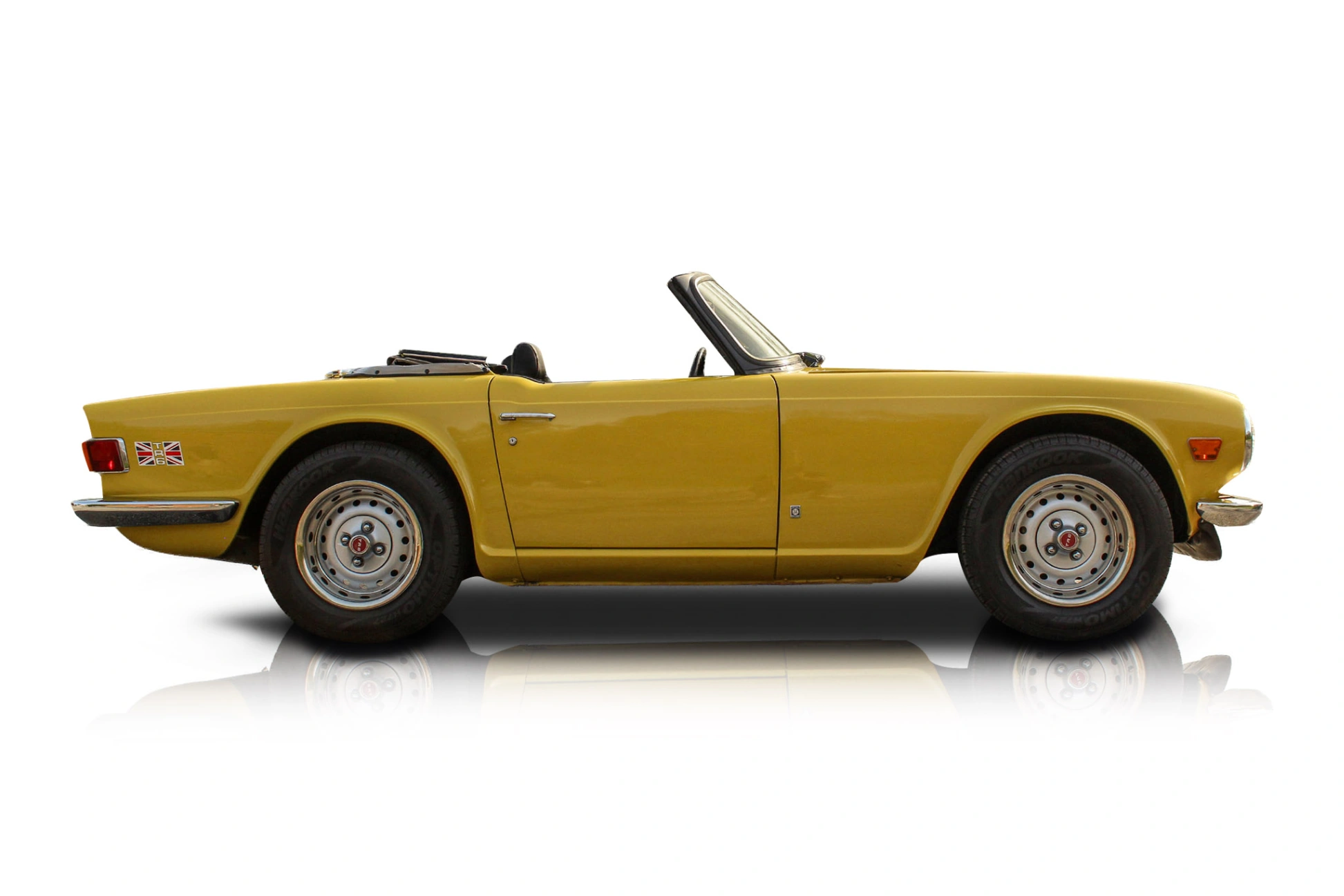 An incredible side shot photo of a Triumph TR6 that you should buy.